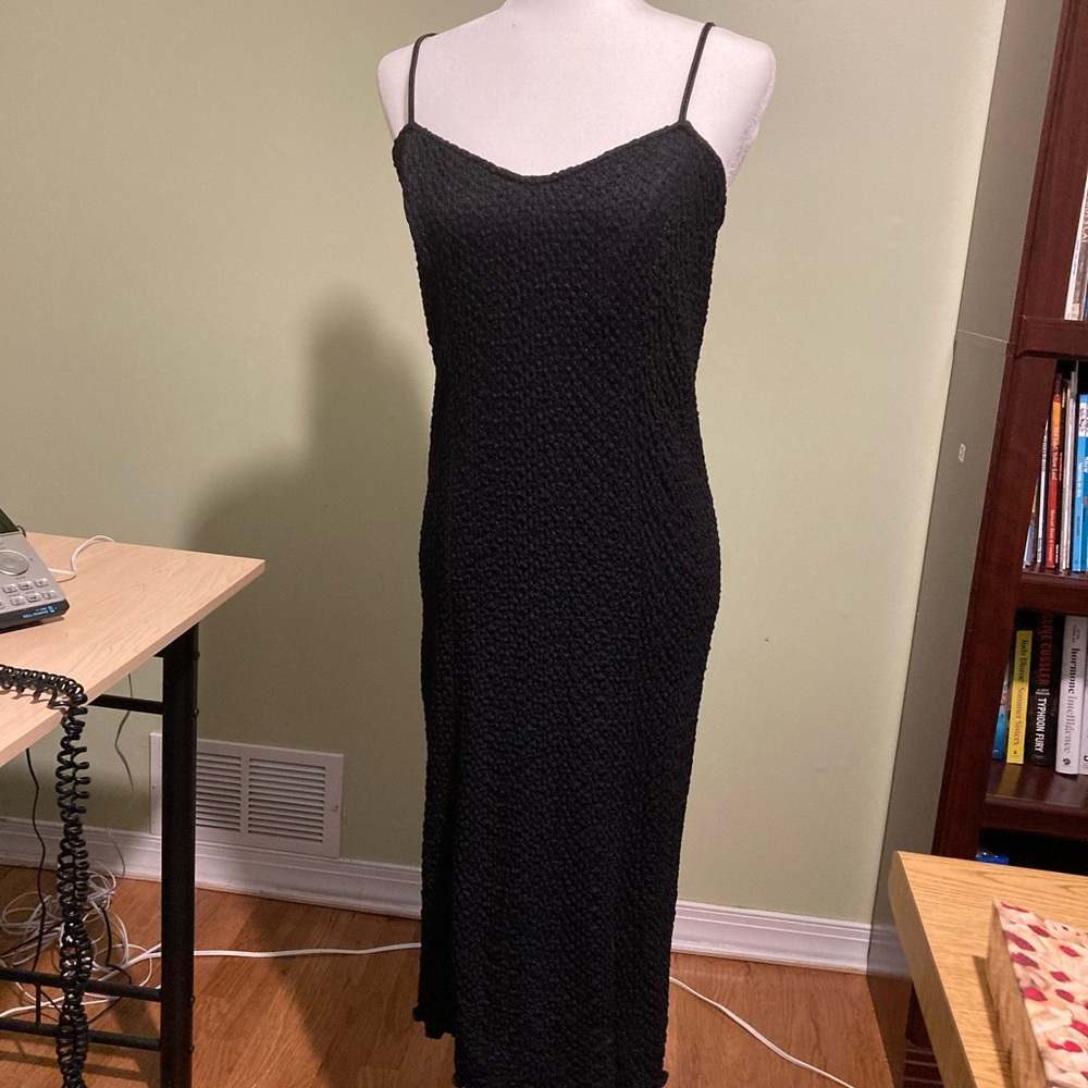 Black two piece dressy dress. Sheath is 100% Rayon. Top piece probably the same